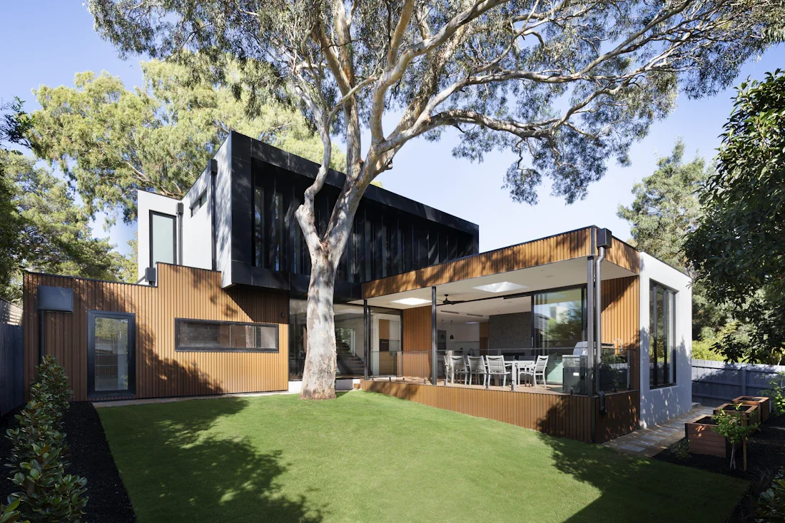House exterior with a timber extension and garden
