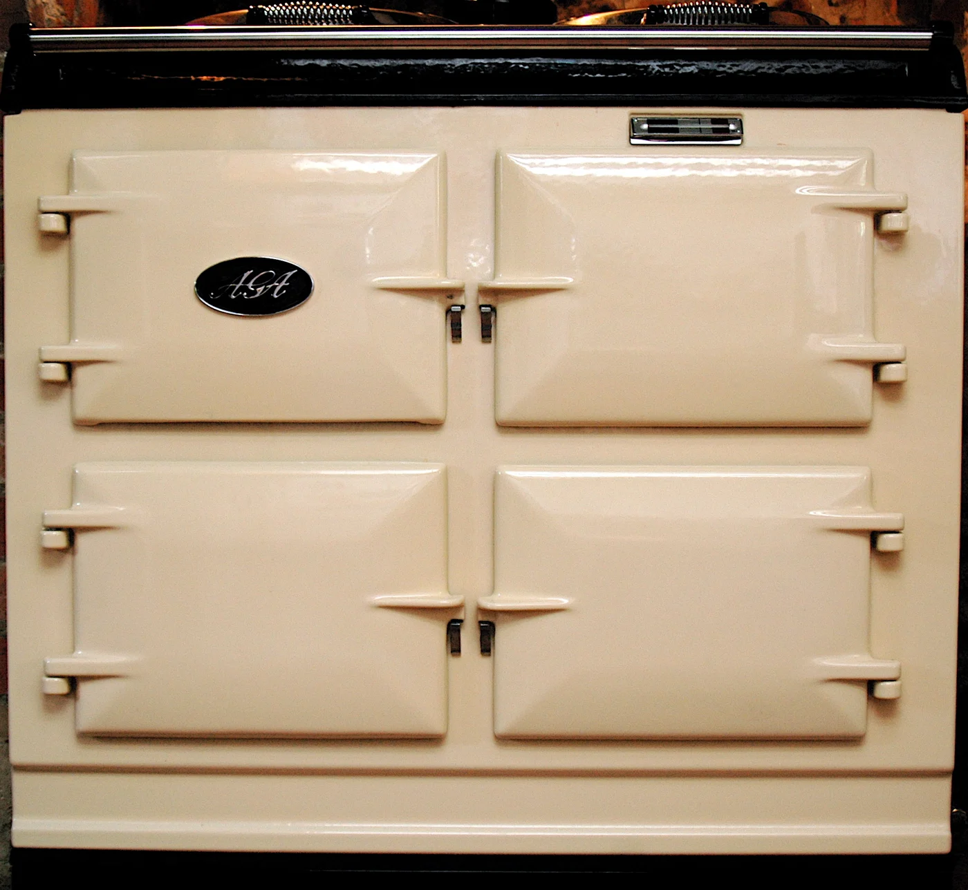 Cream AGA cooker with oven doors and covered hotplates