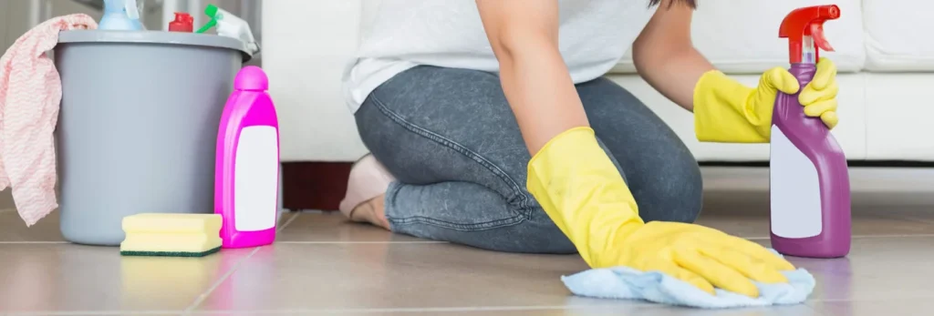 Cleaner wiping a floor surface