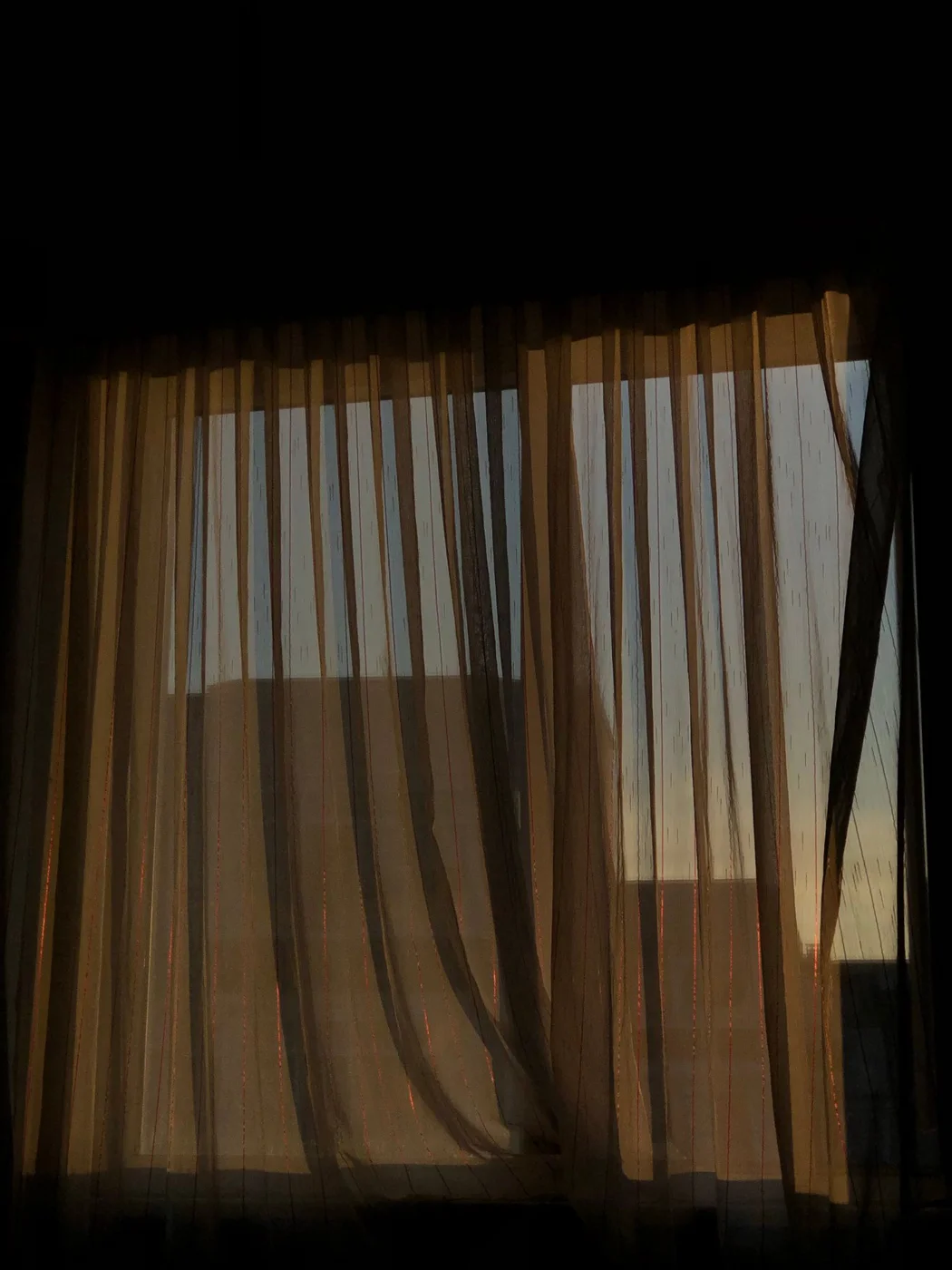 Sheer curtains covering a window