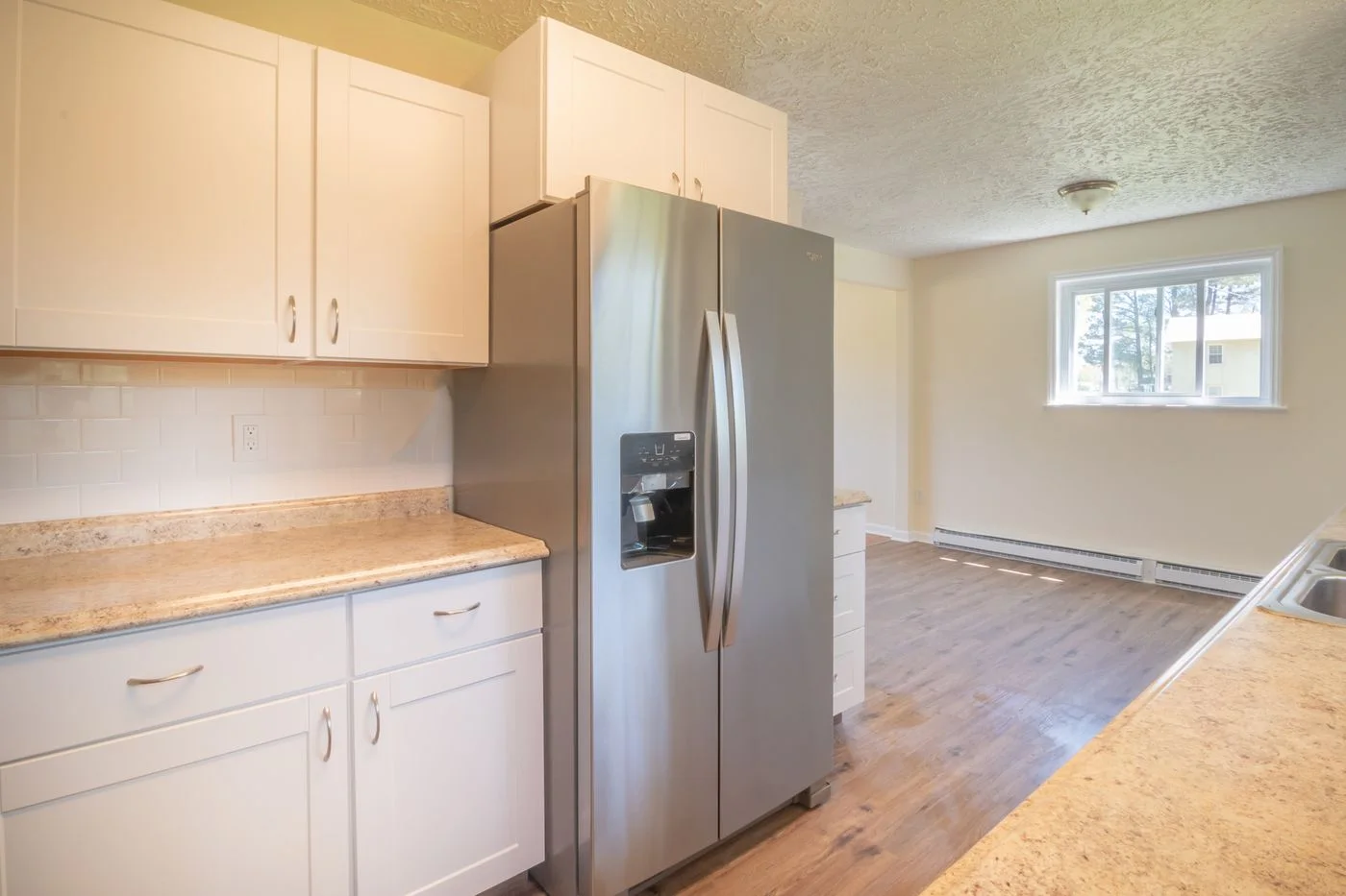 Kitchen with a refrigerator and stainless steel appliances