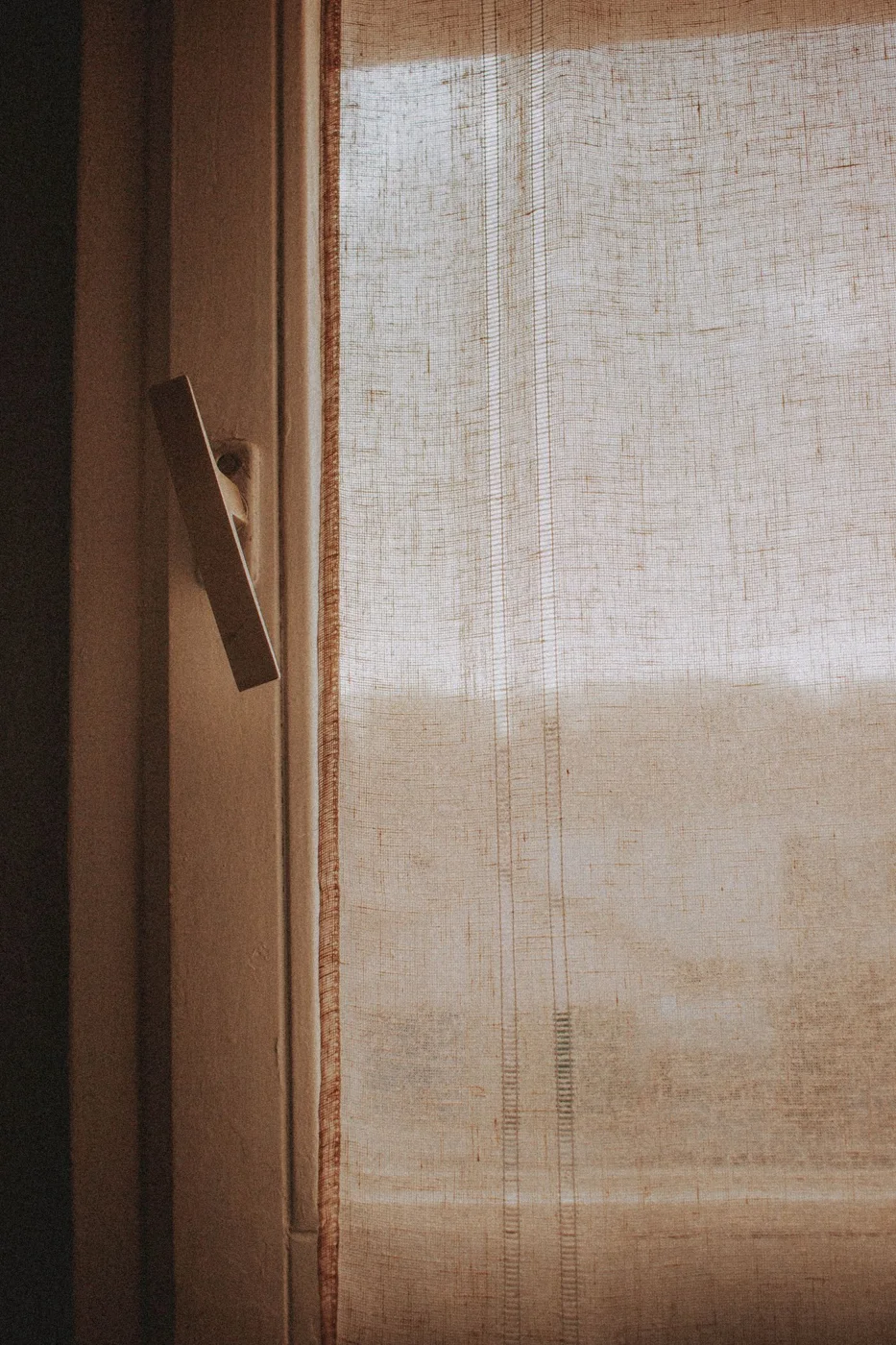 Fabric curtain beside a window