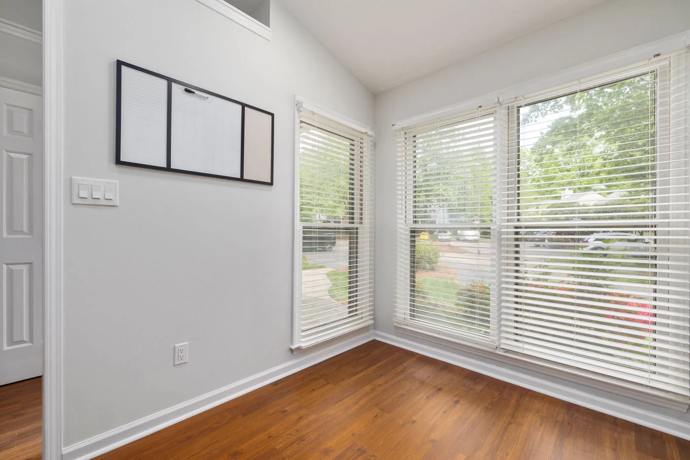 Room with large windows and fitted blinds