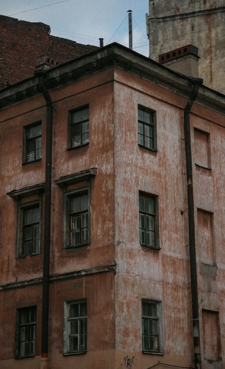 Building facade with windows and roof gutters