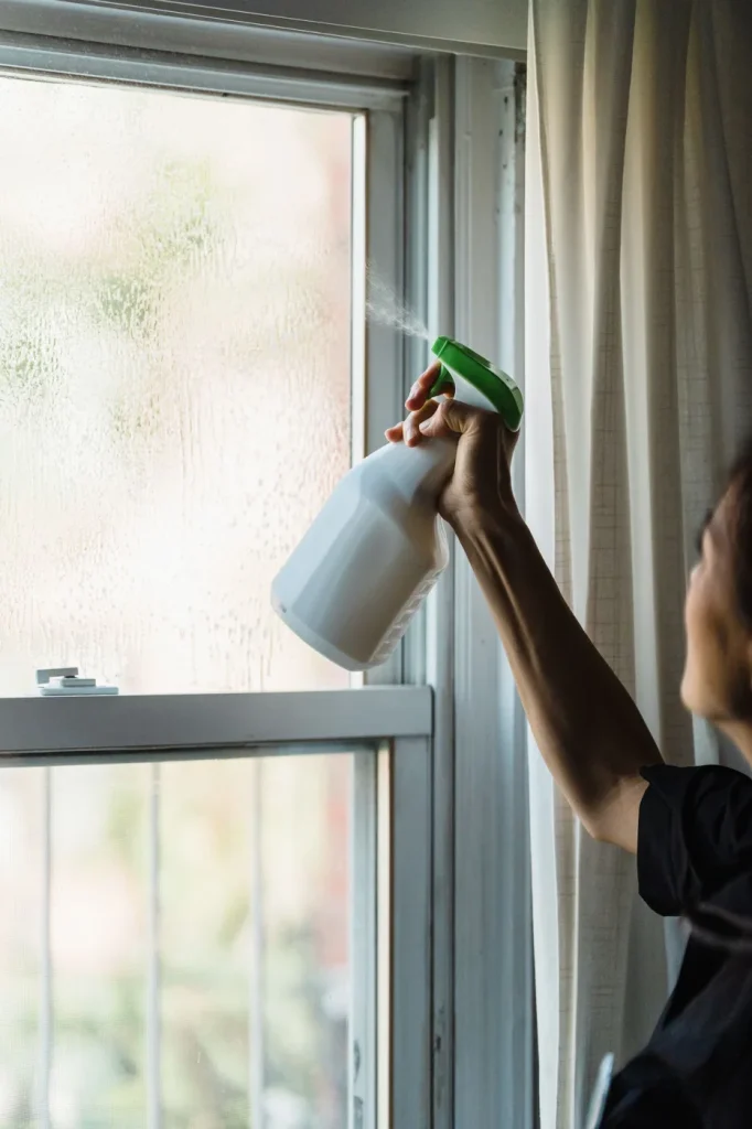Window being wiped with a cloth